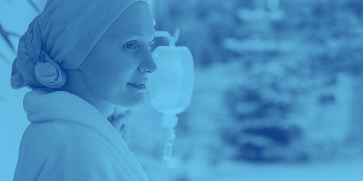 Patient in home looking out the window while receiving home infusion therapy.