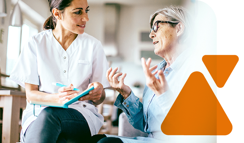 Healthcare provider listening to an infusion patient