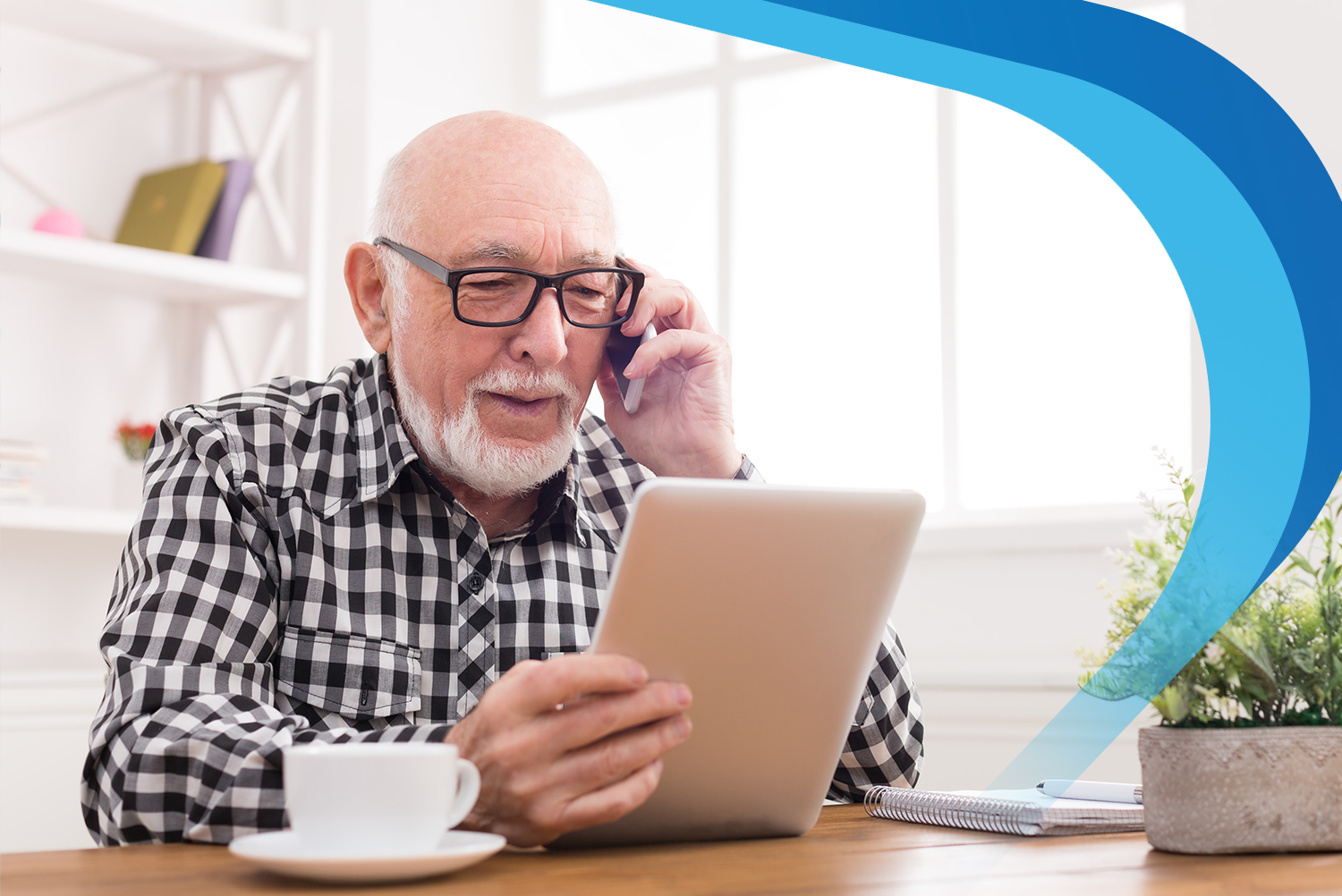 Elder man using a tablet while on a consultation call with a member of the pharmacy team.